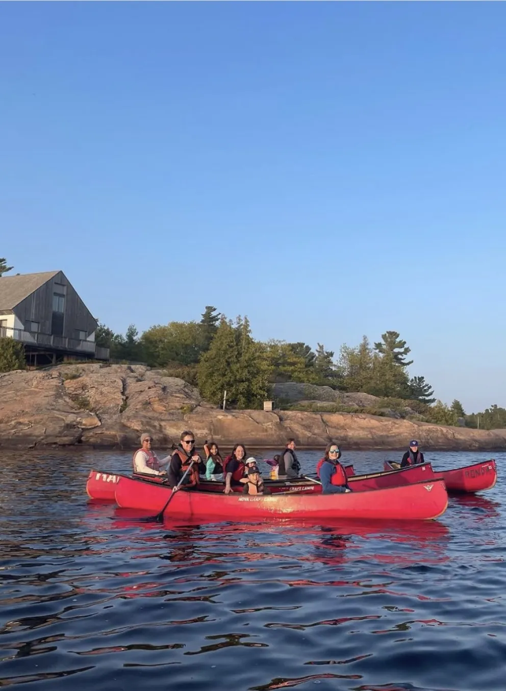 Campers in a canoe on the water