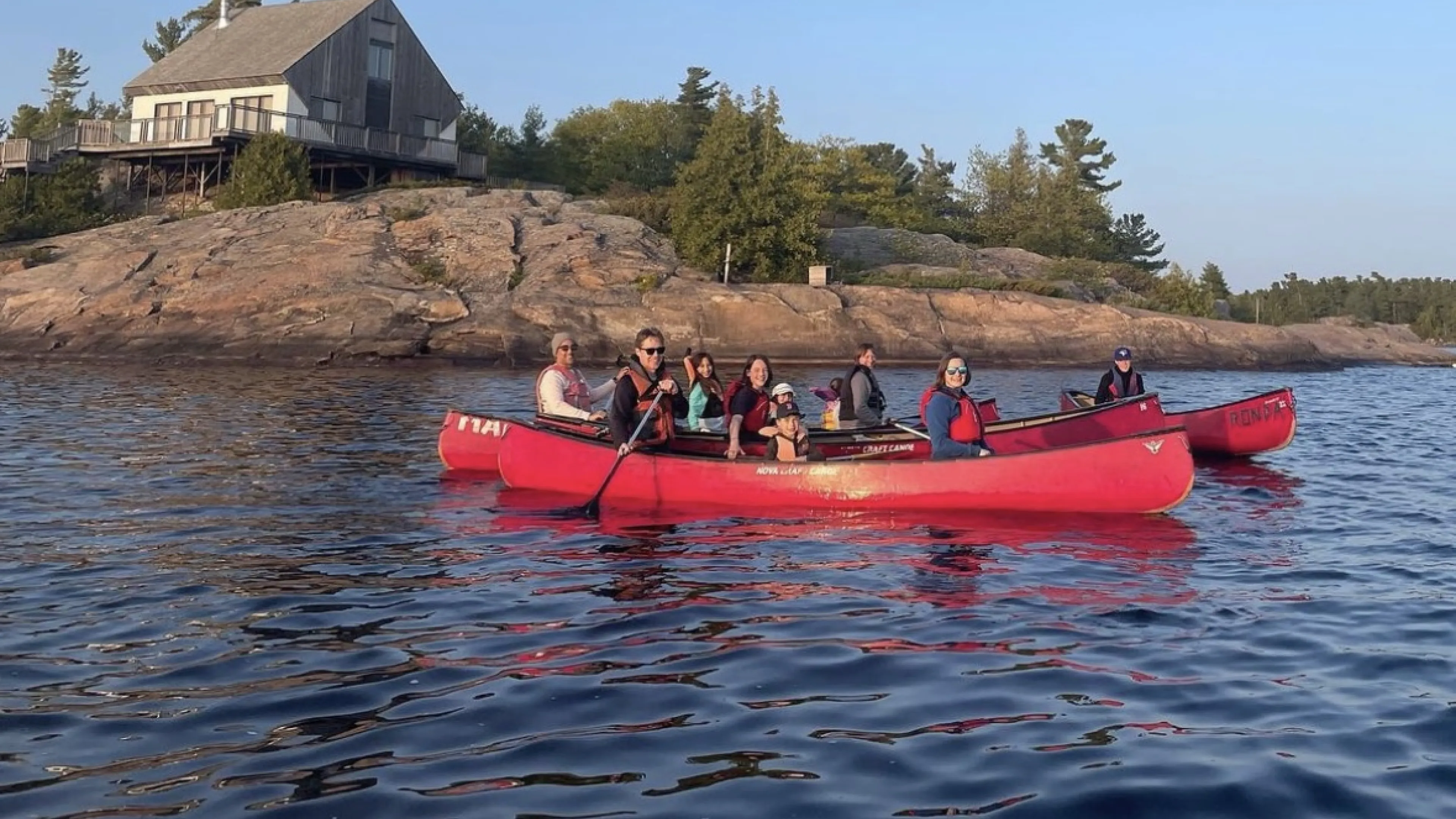 Campers in a canoe on the water